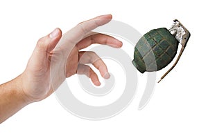 Hand throwing a green grenade on white photo