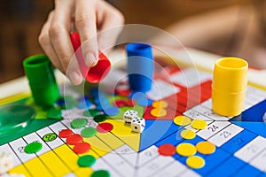Hand throwing two dices playing Parcheesi, Parchis game photo