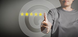 Hand with thumb up positive emotion smiley face icon and 5 star with copy space. Emotional smiley faces showing excellent