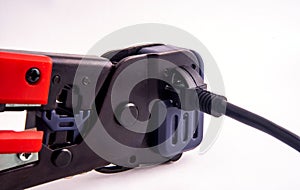 Hand tool for Crimping LAN Cables - closeup rj45