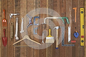 Hand tools and equipments hang on wood board