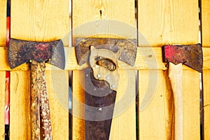 Hand tools hanging on the wall of a barn.