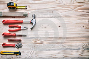Hand tools set on wooden table, copy space