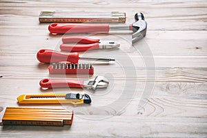 Hand tools set on wooden table, copy space