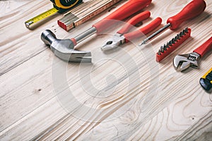 Hand tools set on wooden table, copy space