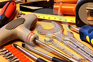 Hand tools on wooden background