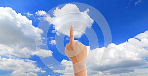 Hand touch blue sky and white cloud