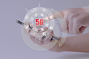 Hand touch infographic on mobile phone of fifth generation wireless technology for digital cellular networks or 5G .