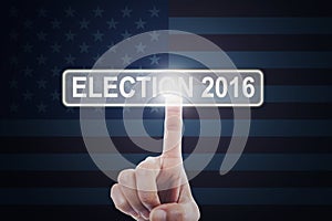 Hand touching the button of election 2016
