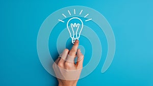 A hand touching a drawn lightbulb symbolizing an idea on a teal background.. AI generated