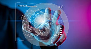 Hand touching futuristic holographic screen displaying customer segmentation data visualization