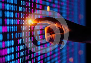 Hand touching glowing binary code on digital display screen