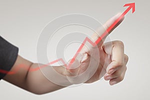 Hand touching  graphs of financial indicator and accounting market economy analysis chart photo