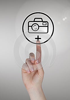 Hand touching photo camera icon