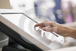 Hand Touching Screen Of Cash Register