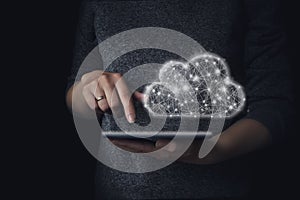 Hand touching tablet with cloud computing and online storage concept. Cloud computing concept - connect devices to cloud