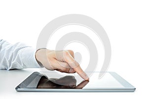 Hand touching tablet computer screen