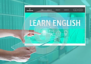 Hand touching a tablet and a Learn English App Interface