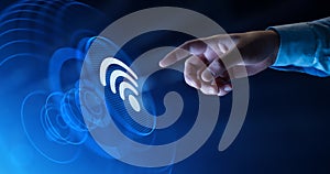Hand Touching WiFi Icon on Digital Screen - Wireless Connection Concept