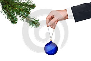 Hand with toy and Christmas tree