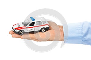 Hand with toy police car