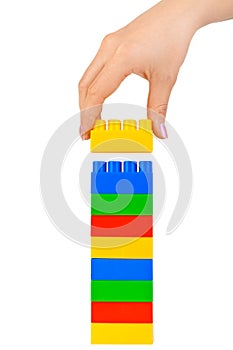 Hand and toy tower