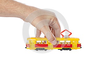 Hand with toy tram