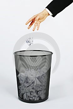 Hand and trashcan