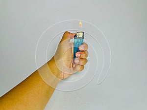 hand tries to light a blue match