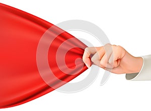 Hand tugging a red cloth with space for text. photo