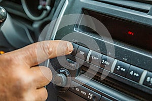 Hand tunes in a car radio