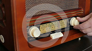 Hand tuning fm radio button. Vintage stereo and control button.