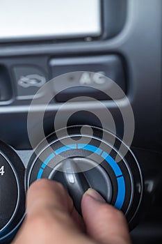 Hand turn knob to car cooling temp adjust photo