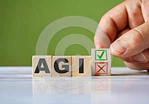 The hand turn wooden block with red reject X and green confirm tick as change concept of AGI. Word AGI conceptual symbol