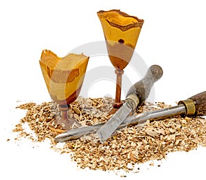 Hand-turned wooden goblets decorated with sawdust and tool