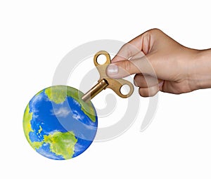 Hand turning mechanic handle to recharge the planet earth on powering planet concept.