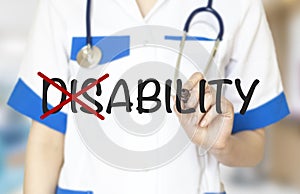 Hand turning the word Disability into Ability with marker