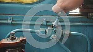 Hand turns on beep signal in old vintage locomotive train.