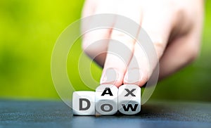 Hand turnsHand turns dice and changes the abbreviation `DOW` to `DAX`. dice and changes the abbreviation photo