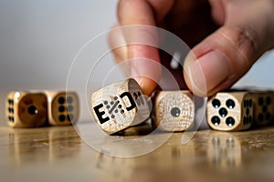 Hand turns dice and changes exclusion to inclusion as a symbol of better inclusion. photo