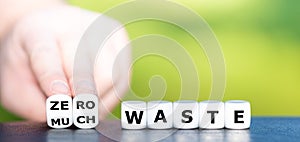 Hand turns dice and changes the expression `much waste` to `zero waste`.