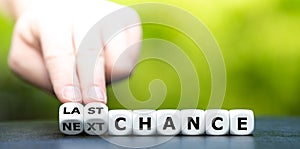 Hand turns dice and changes the expression `next chance` to `last chance`.