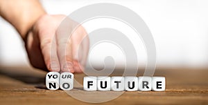 Hand turns dice and changes the expression `no future` to `your future`.