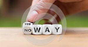 Hand turns a dice and changes the expression `no way` in `yes way`.