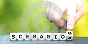 Hand turns dice and changes the expression `scenario A` to `scenario B`.