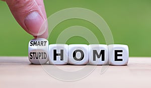 Hand turns a dice and changes the expression `stupid home` to `smart home`.