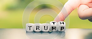 Hand turns dice and changes the name `Trump` to `Truth`.