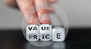 Hand turns dice and changes the word price to value.