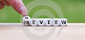 Hand turns a dice and changes the word `review` to `preview`.