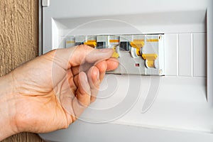 Hand turns on the RCD switch